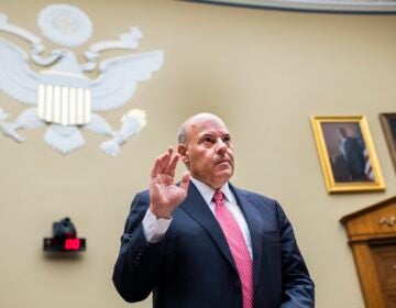 In this Monday, Aug. 24, 2020, file photo, Postmaster General Louis DeJoy is sworn in before testifying during a House Oversight and Reform Committee hearing on the Postal Service on Capitol Hill in Washington. (Tom Williams/Pool Photo via AP)