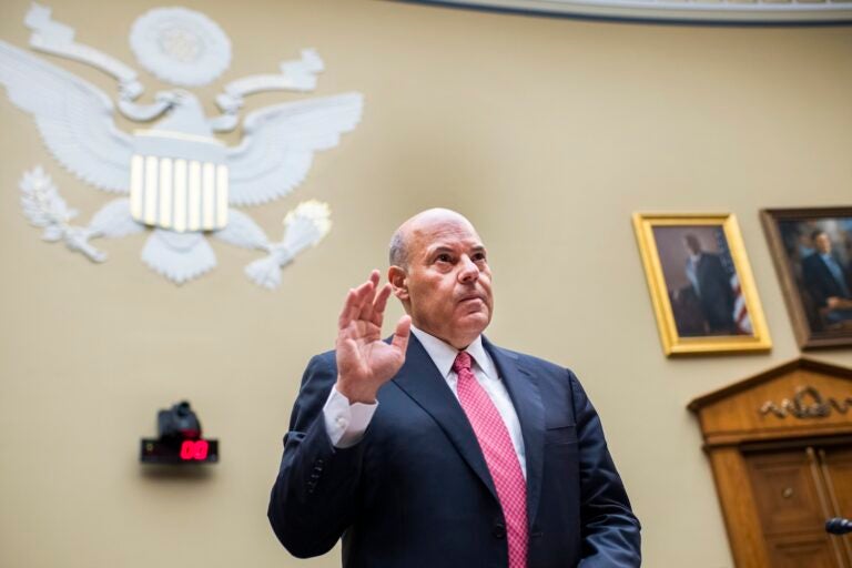 In this Monday, Aug. 24, 2020, file photo, Postmaster General Louis DeJoy is sworn in before testifying during a House Oversight and Reform Committee hearing on the Postal Service on Capitol Hill in Washington. (Tom Williams/Pool Photo via AP)