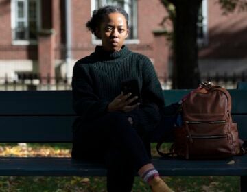 Harvard University graduate student Maya James poses in a park near the university, Wednesday, Oct. 14, 2020, in Cambridge, Mass. (AP Photo/Michael Dwyer)