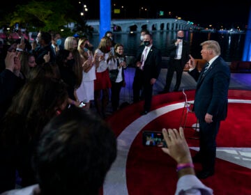 President Donald Trump talks with voters after an NBC News Town Hall, at Perez Art Museum Miami, Thursday, Oct. 15, 2020, in Miami. (AP Photo/Evan Vucci)