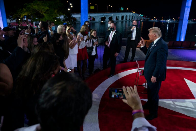 President Donald Trump talks with voters after an NBC News Town Hall, at Perez Art Museum Miami, Thursday, Oct. 15, 2020, in Miami. (AP Photo/Evan Vucci)
