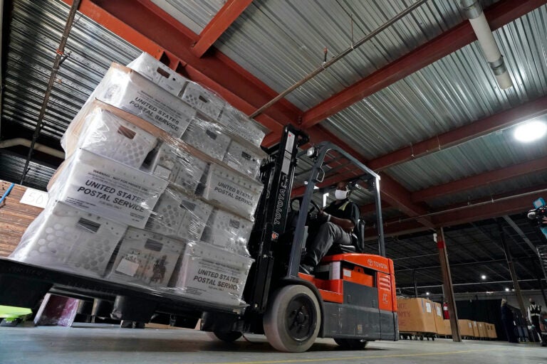 In this Sept. 3, 2020, file photo, a forklift operator loads absentee ballots for mailing at the Wake County Board of Elections as preparations for the upcoming election are ongoing in Raleigh, N.C. (AP Photo/Gerry Broome)