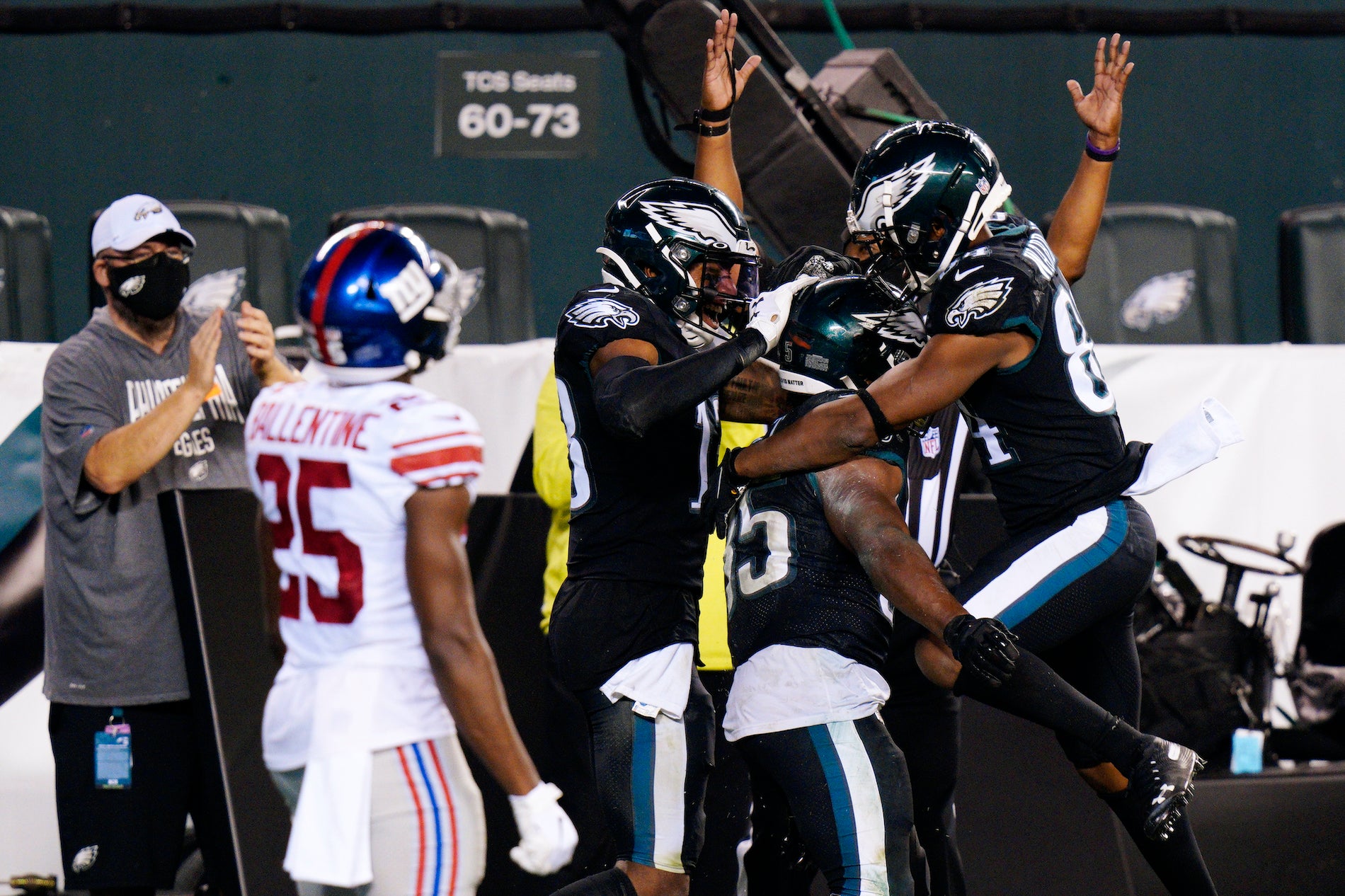 Philadelphia Eagles players celebrate after a touchdown by Boston Scott during the second half of an NFL football game against the New York Giants, Thursday, Oct. 22, 2020, in Philadelphia