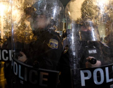 Philadelphia police officers form a line during a demonstration in Philadelphia, late Tuesday, Oct. 27, 2020. (AP Photo/Michael Perez)