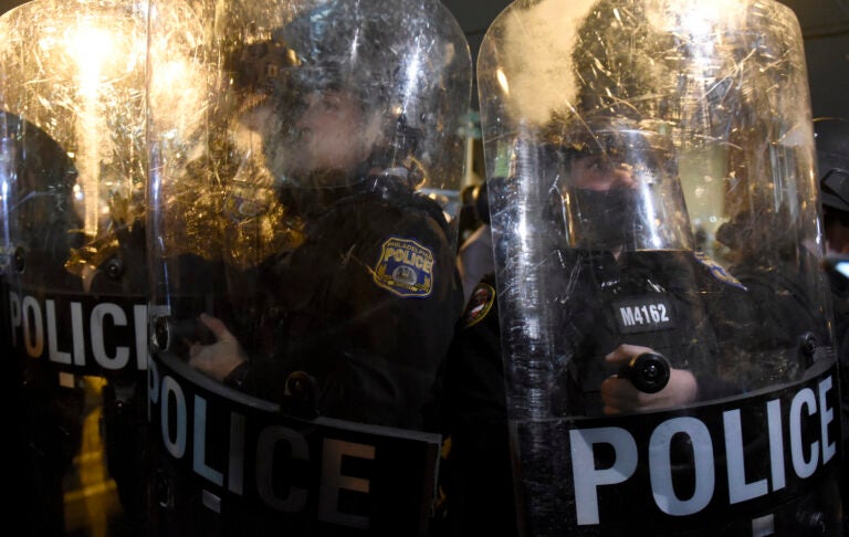 Philadelphia police officers form a line during a demonstration in Philadelphia, late Tuesday, Oct. 27, 2020. (AP Photo/Michael Perez)