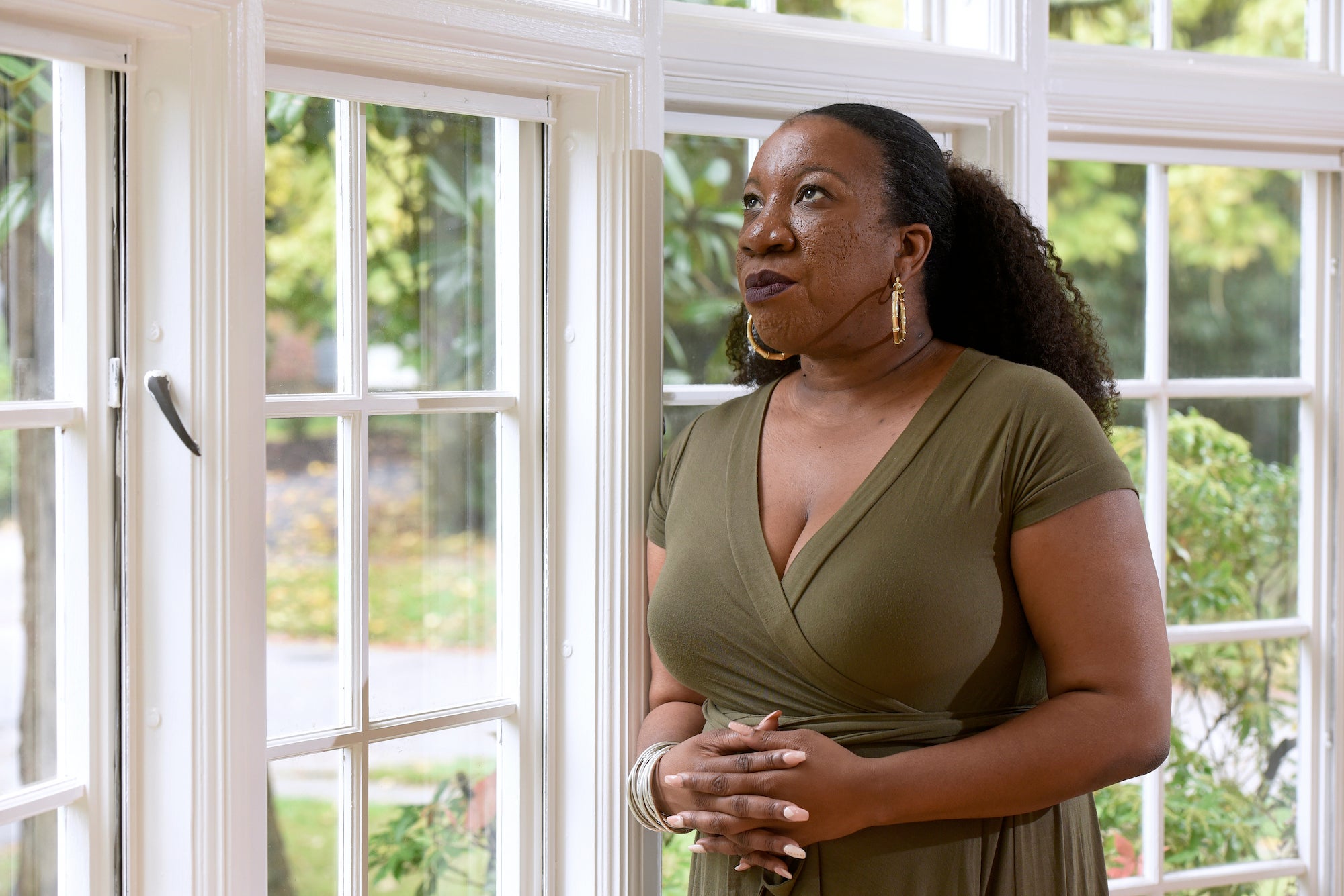 Tarana Burke stands in her home in Baltimore