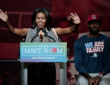 Former first lady Michelle Obama speaks at the University of Akron as NBA star LeBron James listens