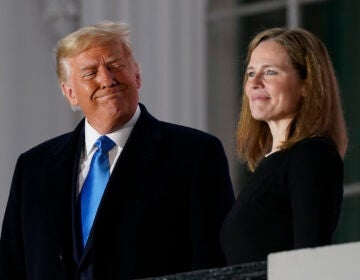 President Donald Trump and Amy Coney Barrett stand on the Blue Room Balcony