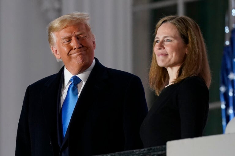 President Donald Trump and Amy Coney Barrett stand on the Blue Room Balcony