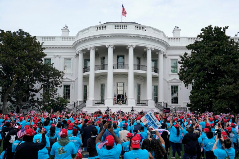 President Donald Trump speaks from the Blue Room Balcony of the White House to a crowd of supporters, Saturday, Oct. 10, 2020, in Washington.