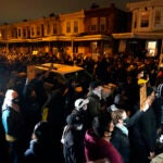 Protesters confront police during a march Tuesday, Oct. 27 in West Philadelphia.