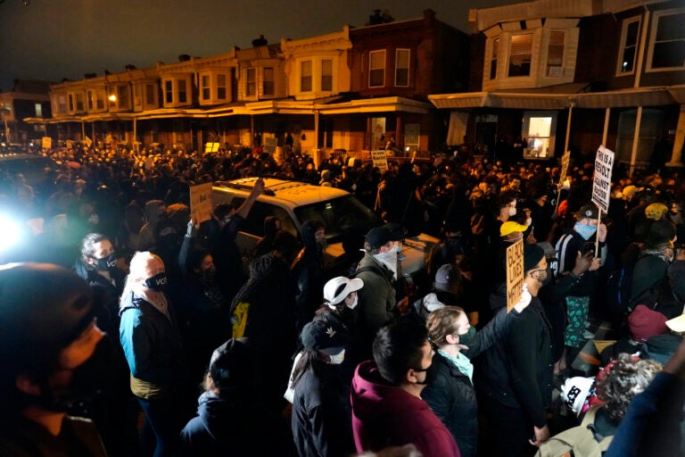 Protesters confront police during a march Tuesday, Oct. 27 in West Philadelphia.