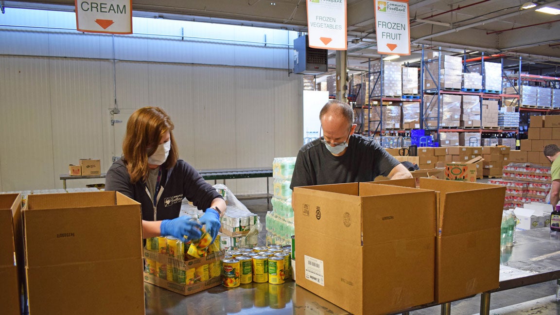 Volunteers sort food at the Community FoodBank of New Jersey.