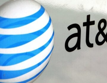 An AT&T logo is displayed on an AT&T truck