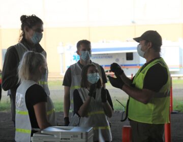 Medical workers at a COVID-19 testing site in McKeesport, Pa. (Katie Blackley/WESA)