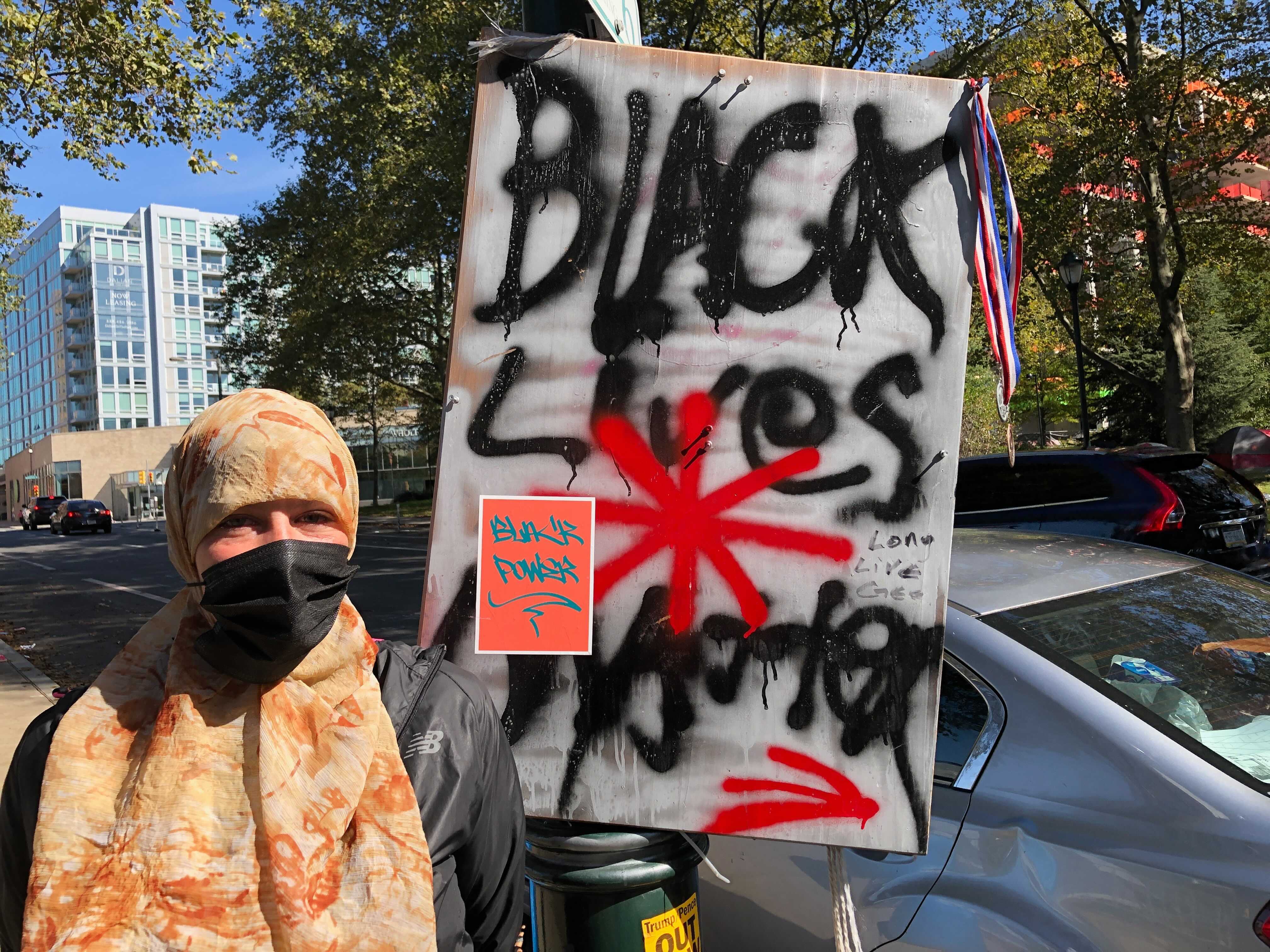 Housing activist Jenn Bennetch with Black Lives Matter sign