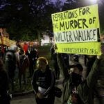 A crowd gathers at Malcolm X Park to protest the police shooting of Walter Wallace Jr. (Emma Lee/WHYY)