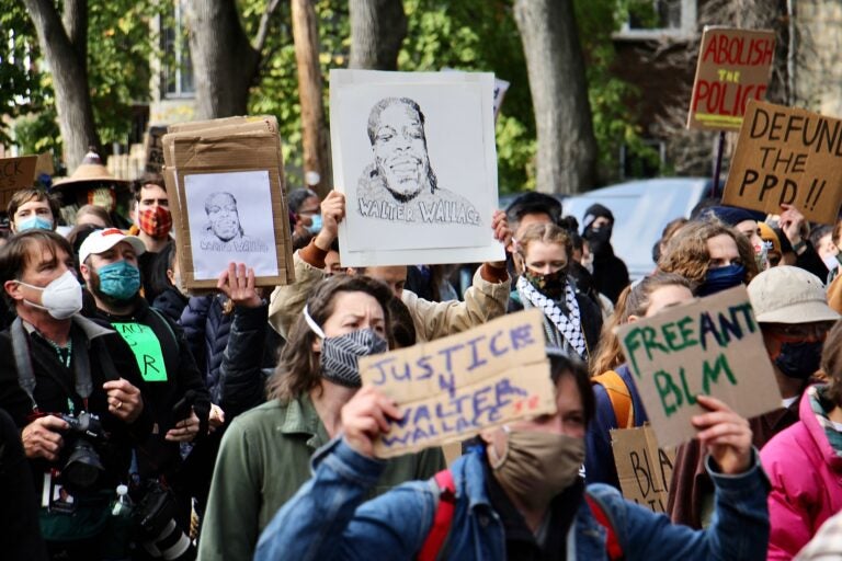 Protesters march from the scene of Walter Wallace Jr.’s killing to Malcolm X Park in Oct. 2020. (Emma Lee/WHYY)