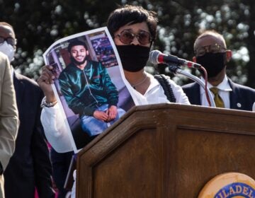 Tamika Morales holds a photo of her son, Ahmad, who was killed July, 2020, in South Philadelphia. (Kimberly Paynter/WHYY)