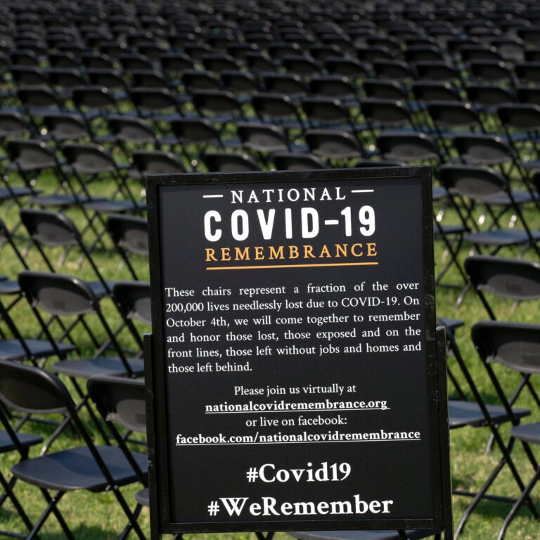 Hundreds of empty chairs who represent a fraction of the more than 200,000 lives lost due the COVID-19 are seen during the National COVID-19 Remembrance, at The Ellipse outside of the White House, Sunday, Oct. 4, 2020, in Washington. (AP Photo/Jose Luis Magana)