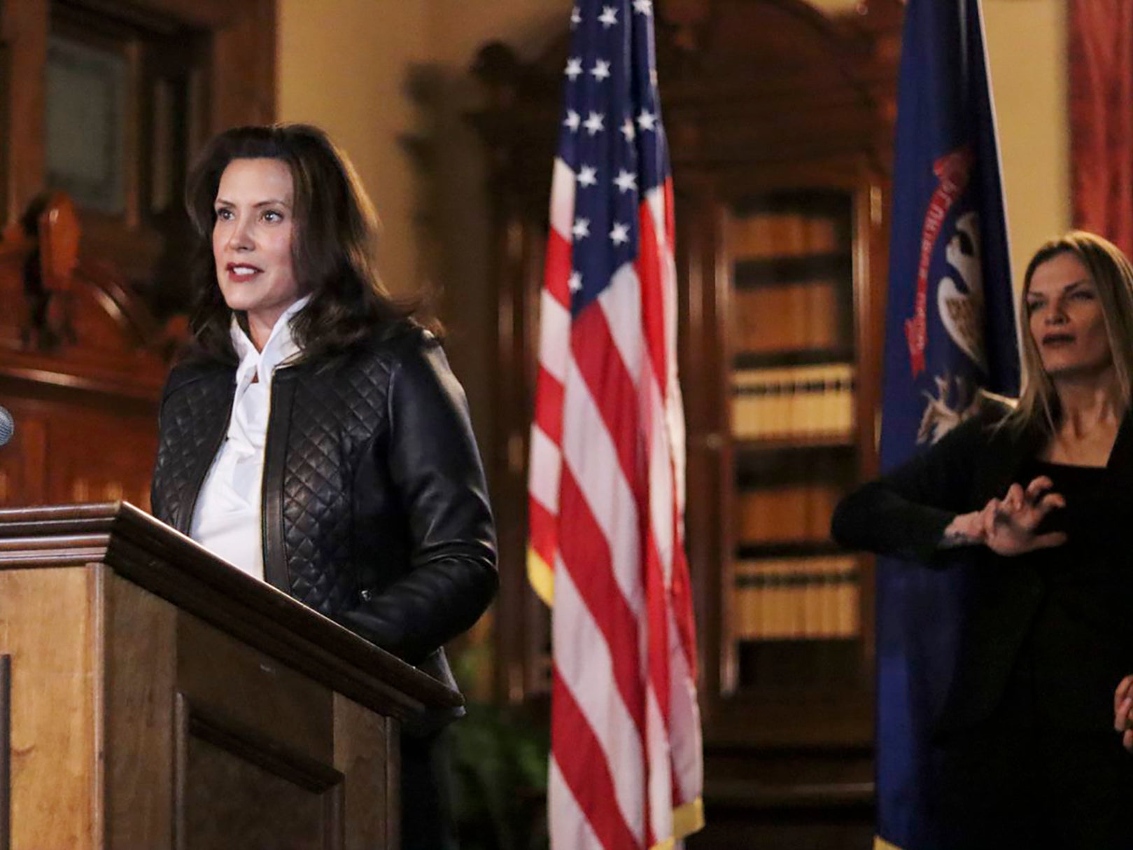 Michigan Gov. Gretchen Whitmer addresses the state during a speech Thursday in Lansing, Mich. Thirteen members of two militia groups face criminal charges after allegedly plotting to kidnap Whitmer. 