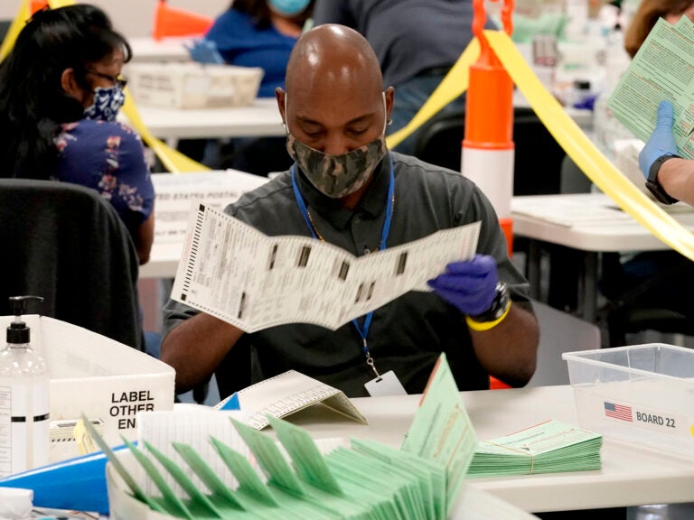 Election workers sort ballots