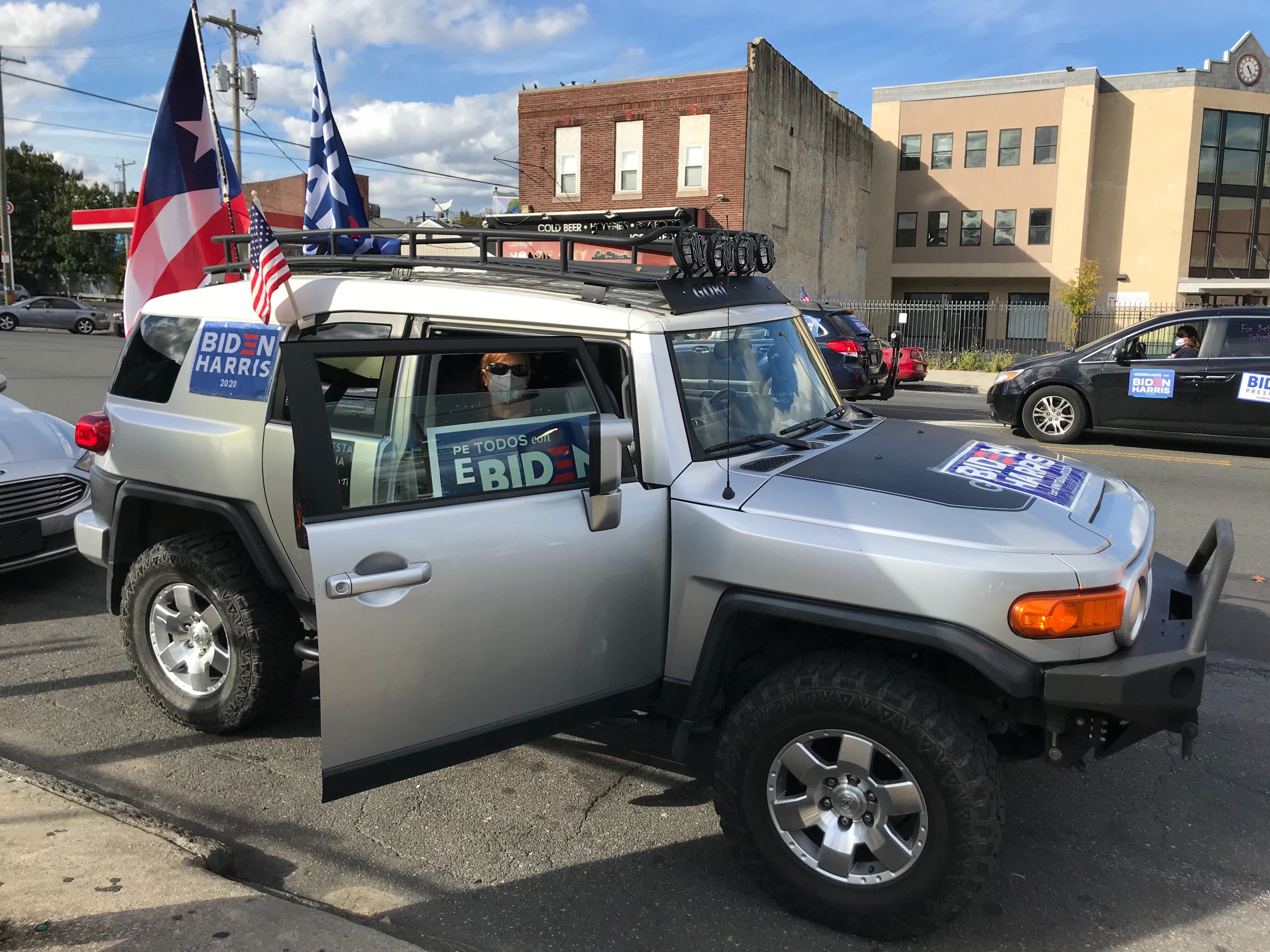 Members of a car caravan whip up support for the Biden/Harris campaign in Philadelphia