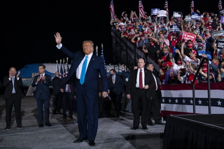 President Donald Trump arrives for a campaign rally at Harrisburg International Airport, Saturday, Sept. 26, 2020, in Middletown. U.S. Rep. Lloyd Smucker, R-Lancaster/York, is at far left. (Evan Vucci/AP Photo)