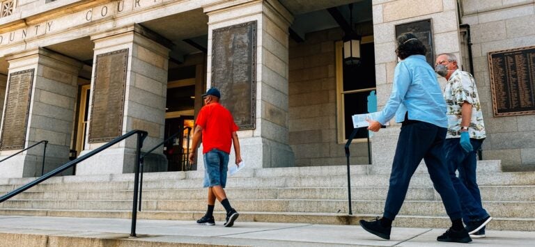 Voters walk along the steps of the York County Courthouse on June 1, 2020, to deposit their ballots in a drop box ahead of the Pennsylvania primary. (Kate Landis/PA Post)