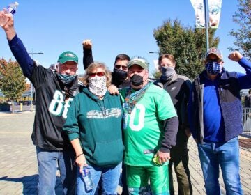 Paul and Sandy Edwards of Quakertown (foreground) and their friends (from left) John Fullerton, Jeff Morris, Tom Cooley, and Mark Lubenetski, arrive at the Linc to watch the first Eagles game of the season that is open to live fans