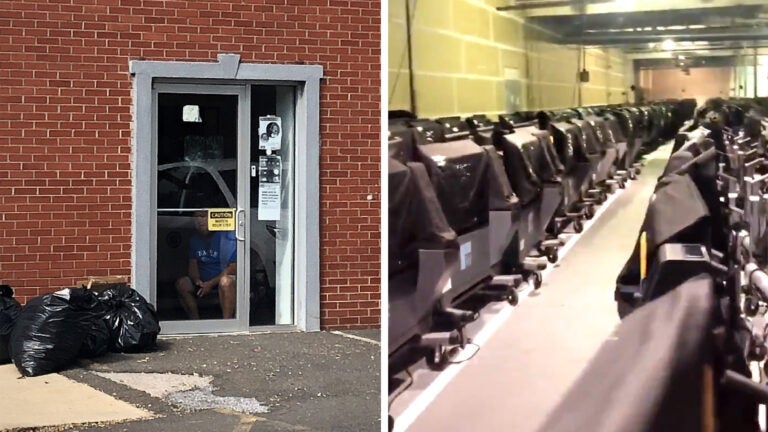 A security guard sitting by the East Falls election warehouse door; voting machines in the warehouse.