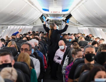 A plane full of masked people