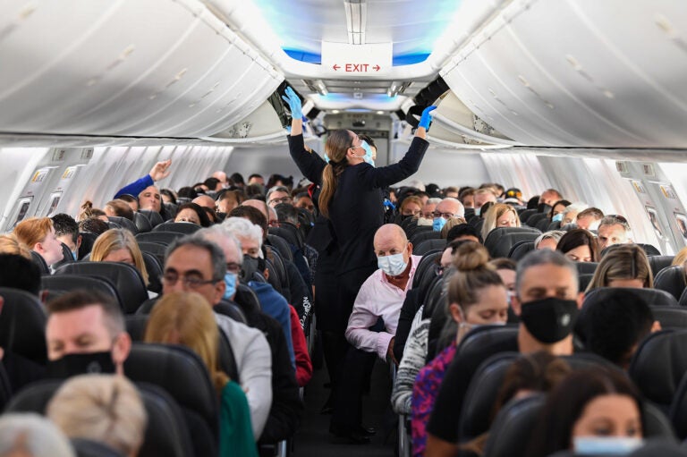 A plane full of masked people