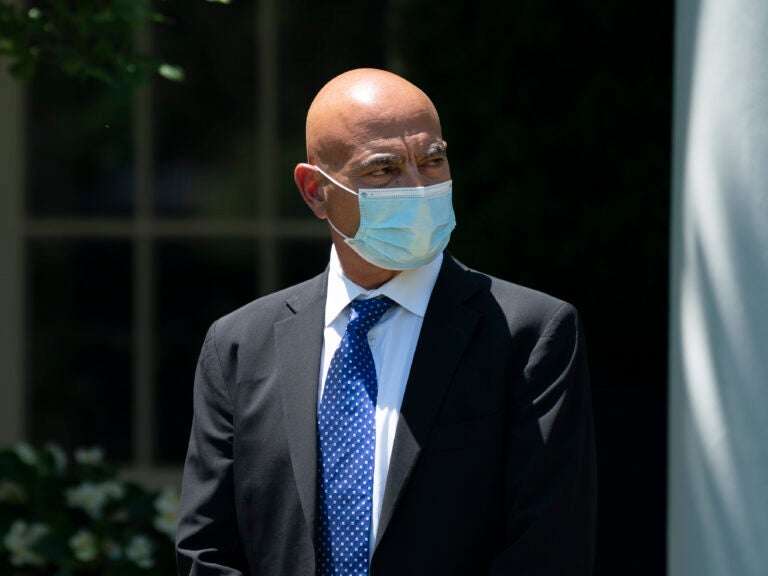 Operation Warp Speed's Moncef Slaoui, seen here at the White House in May, says clinical trials of experimental COVID-19 vaccines will soon reveal if they work. Meanwhile, manufacture of the vaccines is picking up speed. (Drew Angerer/Getty Images)