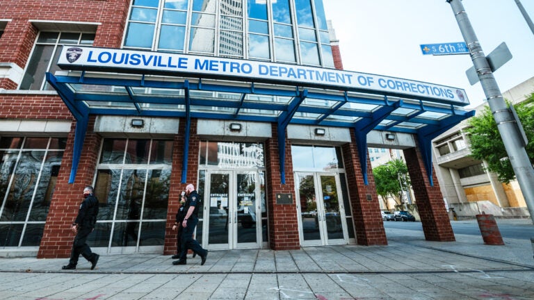 Kentucky's Jefferson County Circuit Court has released audio of the grand jury proceedings in the Breonna Taylor case. Here, police officers walk by the Louisville Metro Department of Corrections, which sits adjacent to Jefferson Square Park, the epicenter for Black Lives Matter protests over Taylor's death. (Jon Cherry/Getty Images)