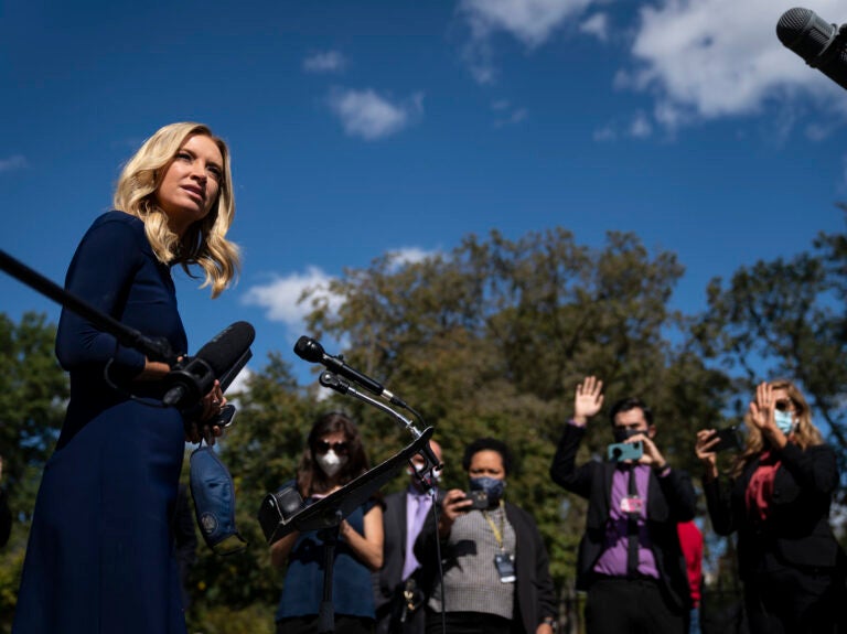 White House press secretary Kayleigh McEnany talks to reporters last week outside the West Wing of the White House. She announced Monday that she tested positive for the coronavirus. White House press secretary Kayleigh McEnany