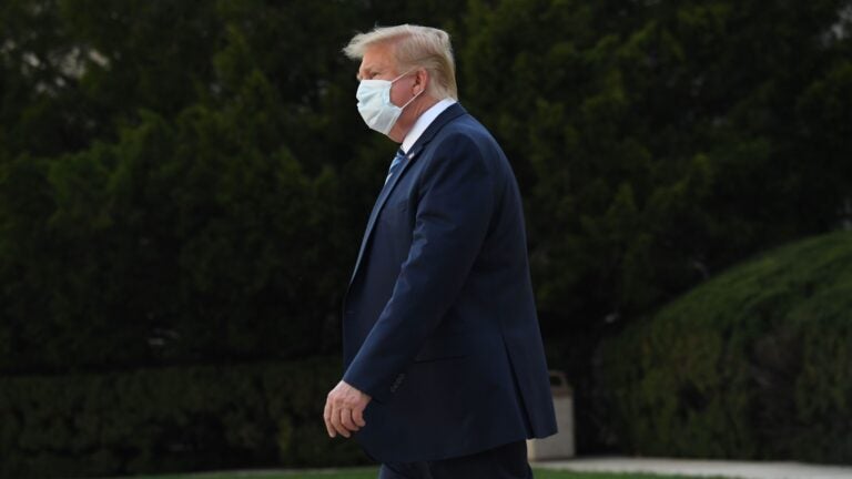 President Trump leaves Walter Reed National Military Medical Center in Bethesda, Md., on Monday. He announced Tuesday he was pausing negotiations on a coronavirus relief package. (Saul Loeb/AFP via Getty Images)