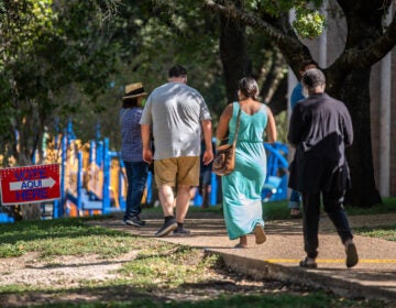 Voters approach a polling location in Austin, Texas, on Oct. 13 — the first day of voting in the state. Nearly 8 million votes already have been cast in Texas. (Sergio Flores/Getty Images)