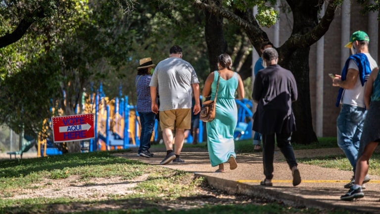 Voters approach a polling location in Austin, Texas, on Oct. 13 — the first day of voting in the state. Nearly 8 million votes already have been cast in Texas. (Sergio Flores/Getty Images)
