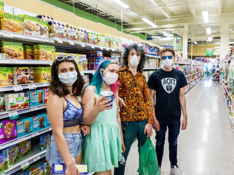 Teens in face masks shopping at Publix, grocery store