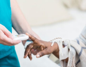 On average, each U.S. nursing home is connected to seven others through shared staff, a study by Yale and UCLA researchers suggests. Rigorous infection control measures can curb spread of the coronavirus, but many workers say they still don't have sufficient masks and other PPE. (SDI Productions/Getty Images)