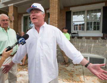 John Dougherty speaks to reporters during an FBI raid of his properties in 2016. (Charles Fox/The Philadelphia Inquirer via AP)