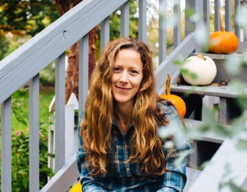 Katie O’Regan sits for a portrait outside her home in Lititz, Lancaster County. O’Regan decided to vote in person after running into a problem with her mail-in ballot application. She says official-looking mail from outside groups is confusing voters. (Kate Landis/WITF)