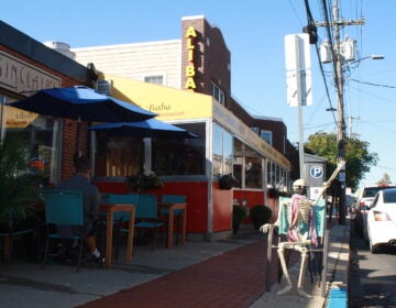 A skeleton sits outside Ali Baba restaurant in Newark