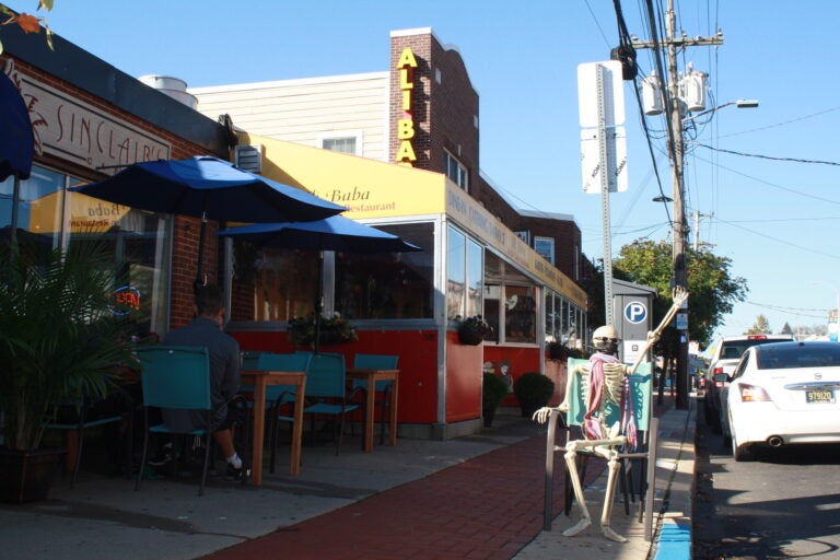 A skeleton sits outside Ali Baba restaurant in Newark