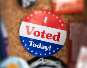 An 'I Voted' sticker appears on a bulletin board