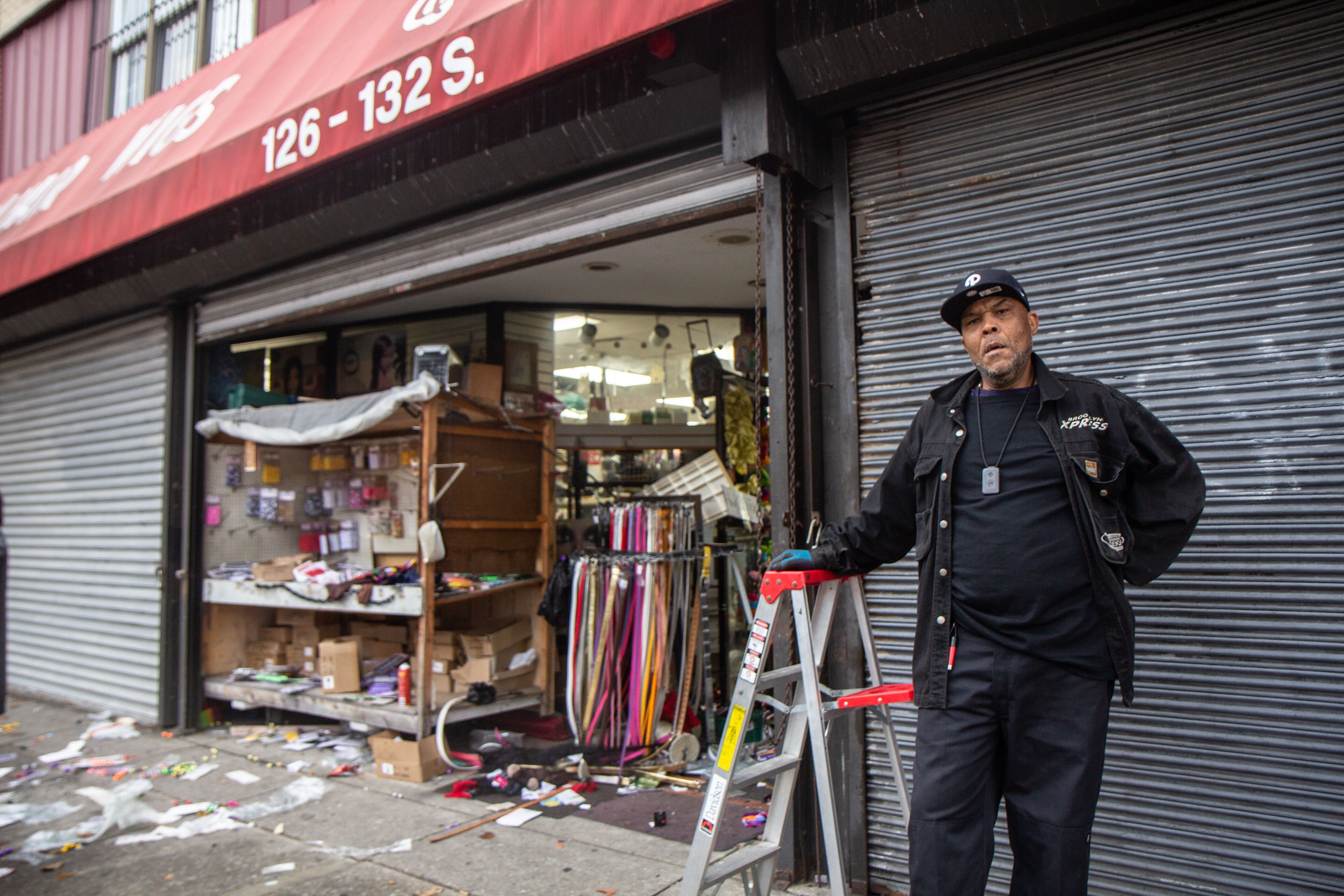 Steven Hall works at Q&S beauty supply and argues with bystanders defending looting on 52nd Street