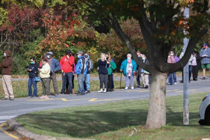 Voters wait in a long line in the cold to cast their vote on election day Tuesday, November 3, 2020, at Thurgood Marshall Elementary School in Newark, Del. (Saquan Stimpson for WHYY)