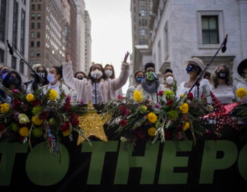 The Resistance Revival Chorus performs in front of City Hall, onboard a flatbed truck, as part of a voter motivational effort called 