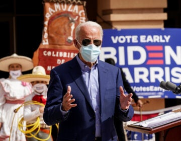 Members of a mariachi band look on as Joe Biden discusses the disproportionate ways coronavirus has impacted Latinos in Nevada during a campaign stop at the East Las Vegas Community Center in Las Vegas on Oct. 9.